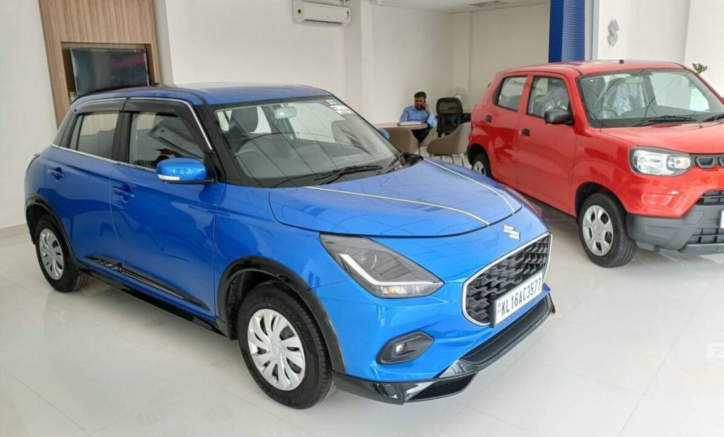 Maruti Swift interior features flat-bottom steering and cockpit layout
