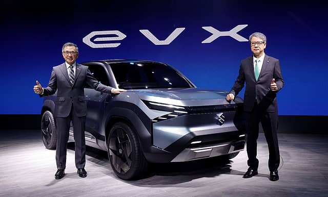 Suzuki unveils futuristic EVX electric SUV at auto expo with executives showcasing the concept model